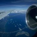 000547 Survol de la mer de Sulu entre Manille et Cagayan de Oro (Philippines). Image ralise depuis le hublot d'un DC 9 McDonnel Douglas dont on voit ici une aile et un racteur.