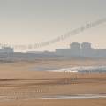 000897 Jeune femme pratiquant le jogging sur la plage d'Hossegor (40150) (Landes (40), France). Prise de vue en hiver.